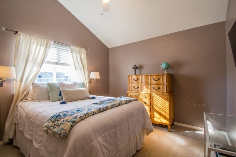 Bright and inviting bedroom interior with neutral tones and elegant decor.