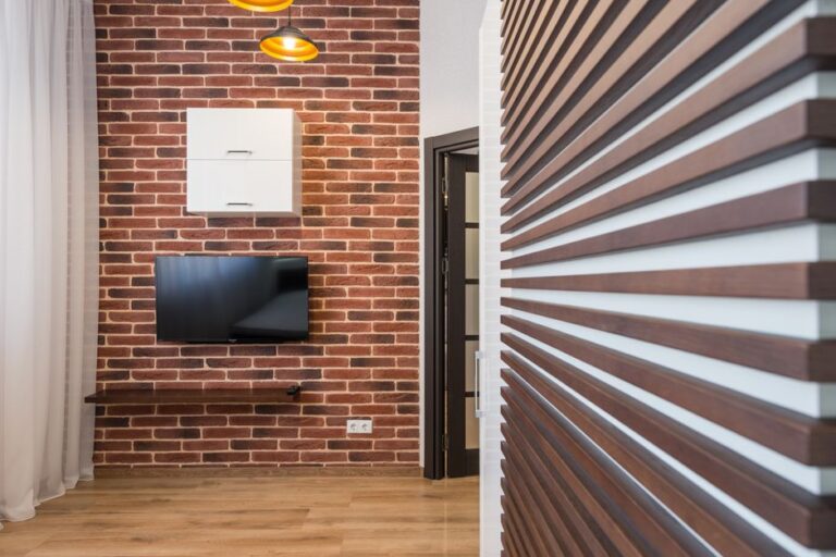 Stylish interior with brick wall, mounted TV, and wooden details for a modern home design.